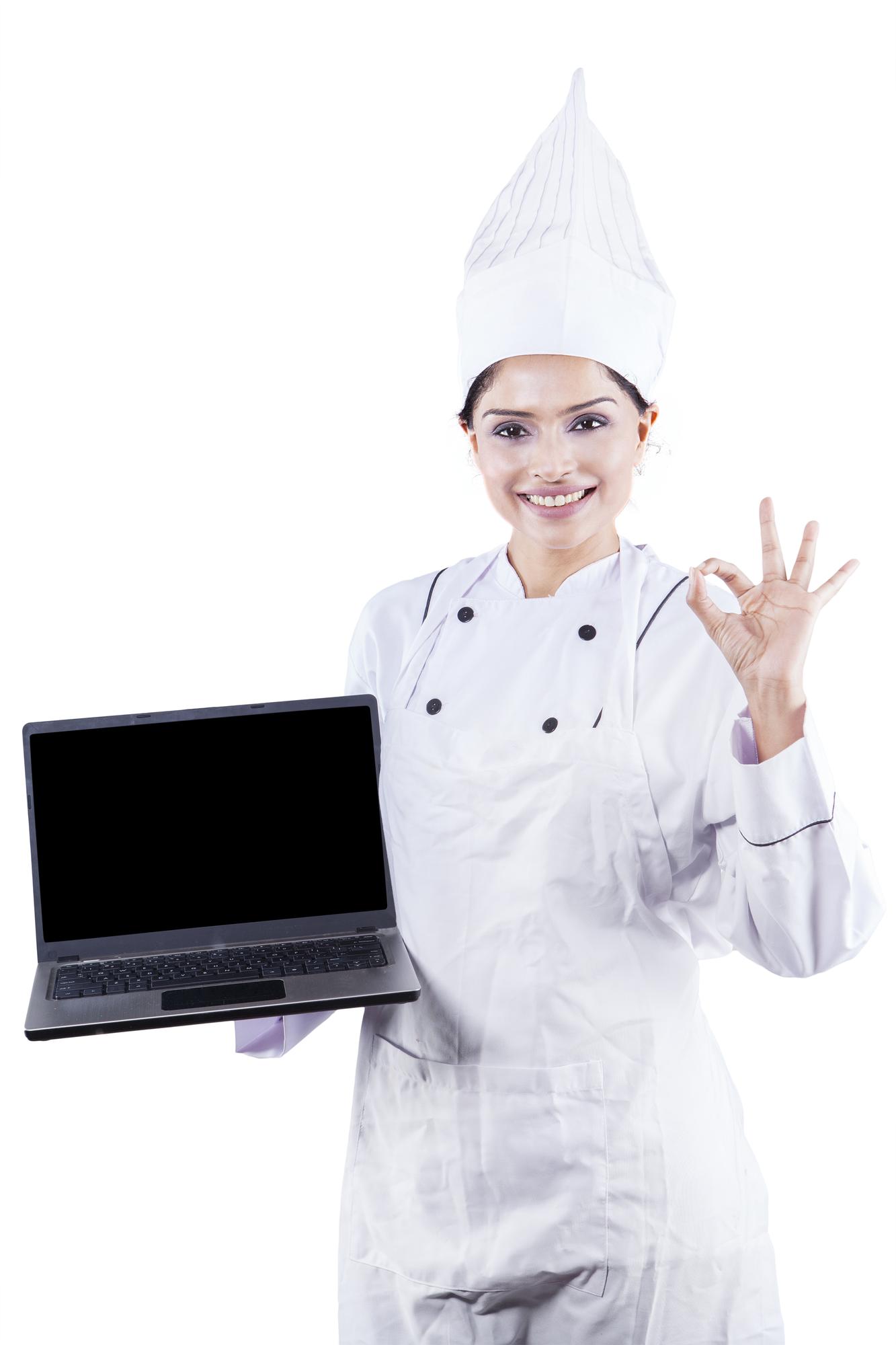 Students cooking together guided by a chef on a laptop